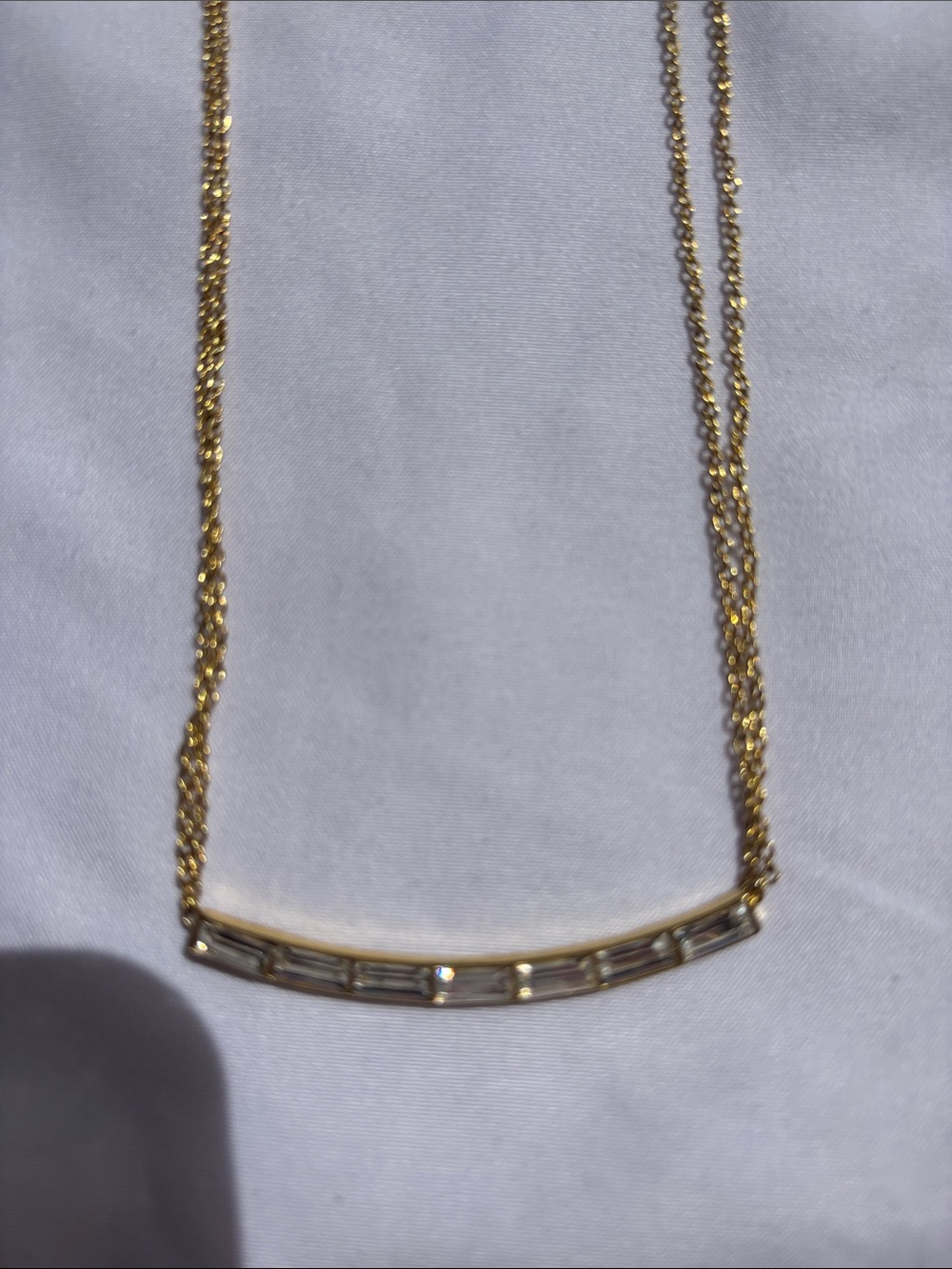 Gold Curved Bar Necklace with Baguette Crystals